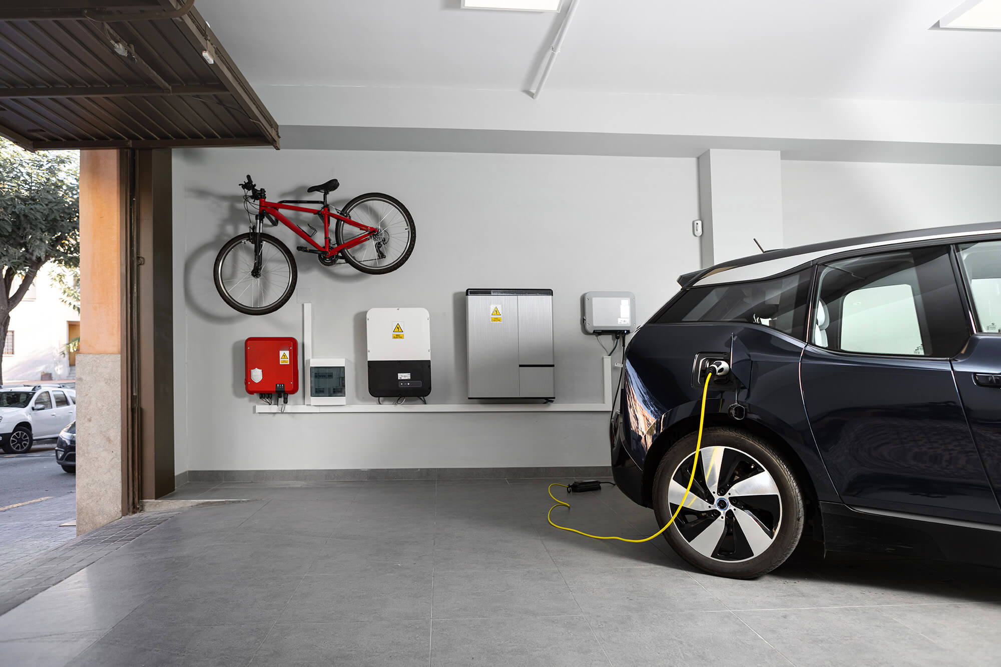 Home garage with electric vehicle charger installed in the wall