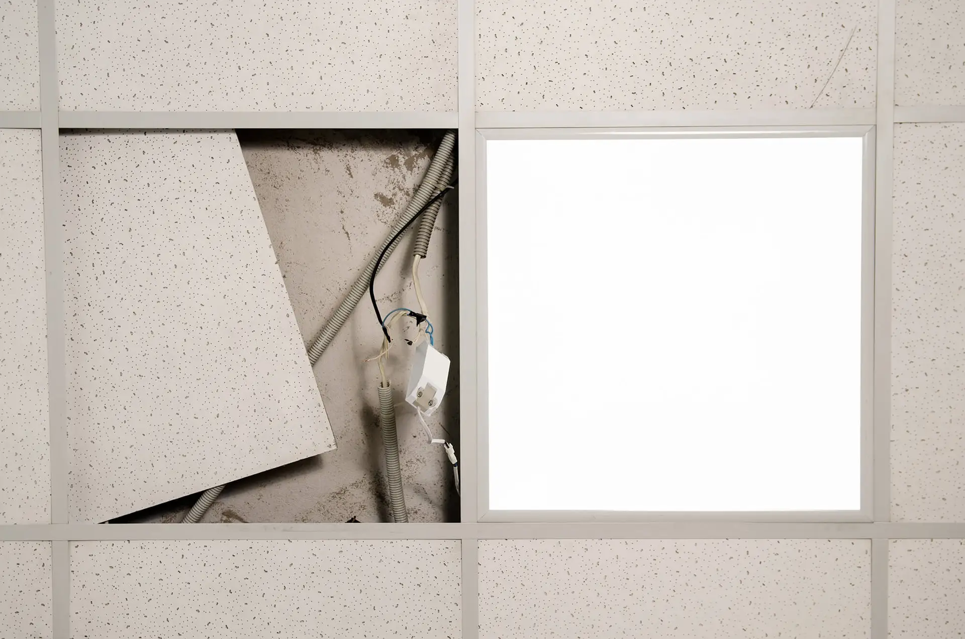 Fluorescent light repair in office ceiling